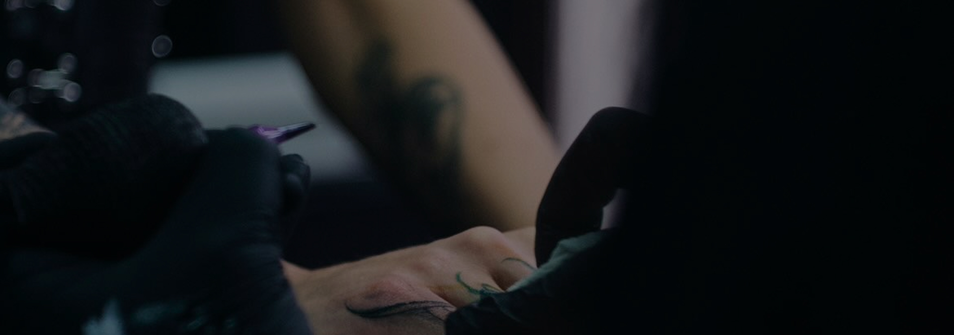 Artist working on a tattoo